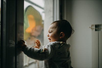 Toddler crying at the window