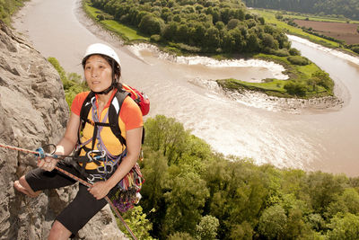 Woman rappelling of cliff in south wales