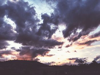 Scenic view of landscape against cloudy sky