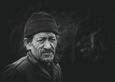 Close-up portrait of senior man wearing knit hat