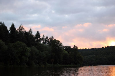 Scenic view of lake against sky at sunset