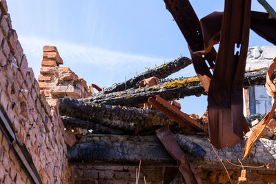 Old rusty metallic structure against sky