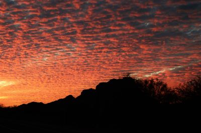 Scenic view of dramatic sky during sunset