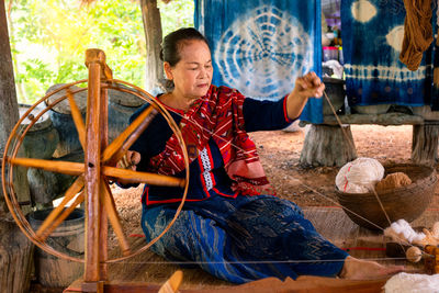 Senior woman working in workshop