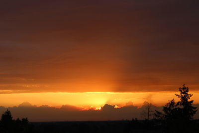 Scenic view of silhouette landscape against romantic sky at sunset