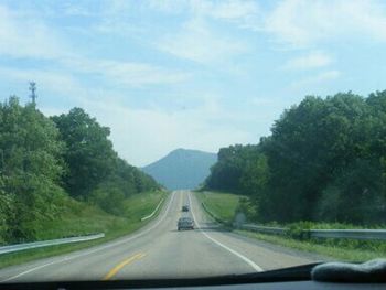 Road passing through forest