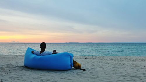 Man on beach against sky