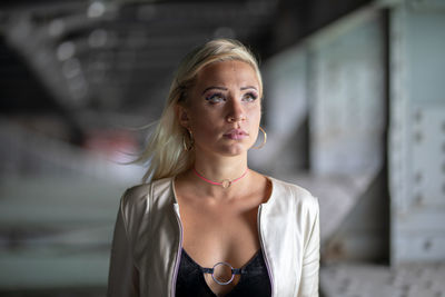 Fashionable young woman standing in subway