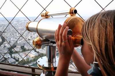 Portrait of woman holding telescope fiel glass