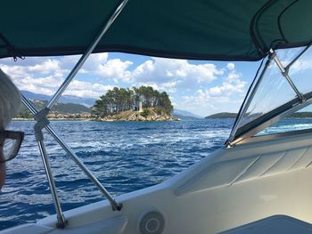 Panoramic view of sea seen through car window