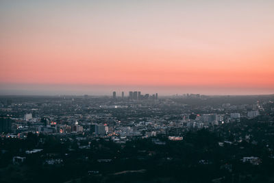 High angle view of buildings against sky during sunset