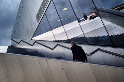 High angle view of man walking in city