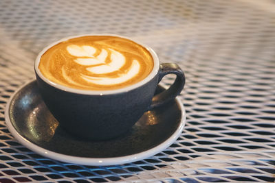 Close-up of cappuccino on table