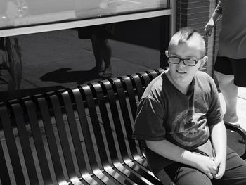 Boy sitting outdoors