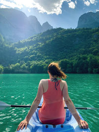 Rear view of woman looking at mountains