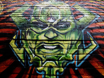 Full frame shot of graffiti on brick wall