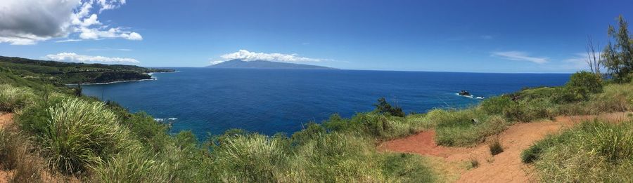 Scenic view of sea against blue sky