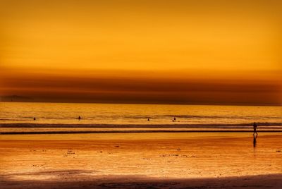 Scenic view of sea at sunset