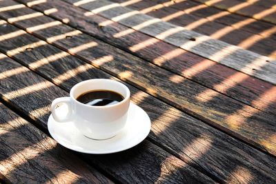 High angle view of coffee cup on table