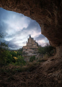 Low angle view of rock formations against sky