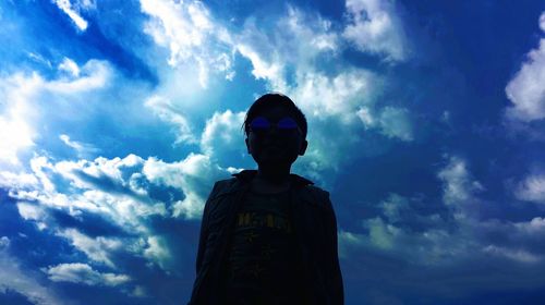 Low angle view of statue against blue sky