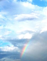 Low angle view of rainbow against sky