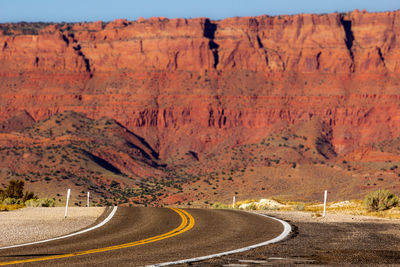 Scenic view of road by mountain