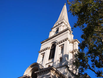 Low angle view of building against clear blue sky