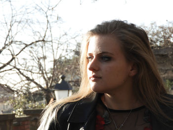 Portrait of a beautiful young woman looking away