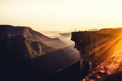 Scenic view of mountains against sky during sunrise