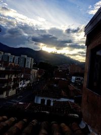 Buildings in town at sunset