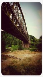 Bridge over river against sky