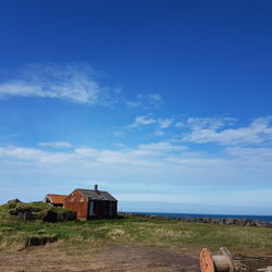 View of calm sea against blue sky