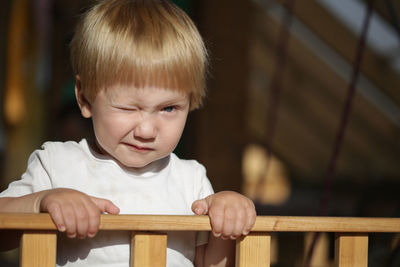Close-up of cute boy looking away