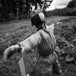 Rear view of man standing on field