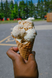 Ice cream in hand melting 