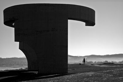 Bridge over sea against clear sky