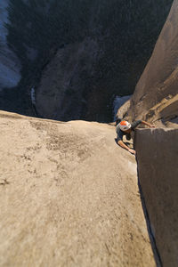 Rock climber crack climbing on the nose, el capitan in yosemite