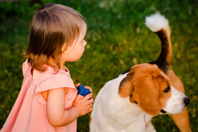 Cute girl and dog at back yard