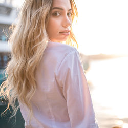 Portrait of beautiful young woman standing outdoors