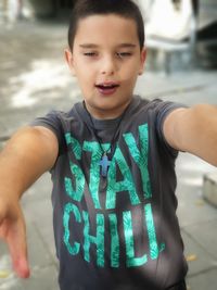 Portrait of boy standing outdoors