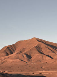 Scenic view of desert against clear sky