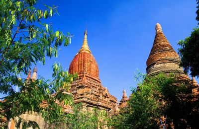 Low angle view of temple building against blue sky