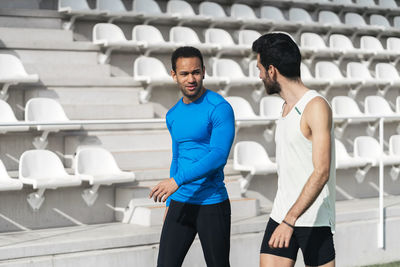 Young men walking at stadium