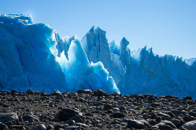 Panoramic view of landscape against clear blue sky