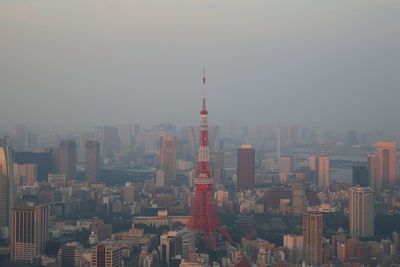 Cityscape against sky. view over tokyo tower from mori tower, roppongi hills, tokyo, japan