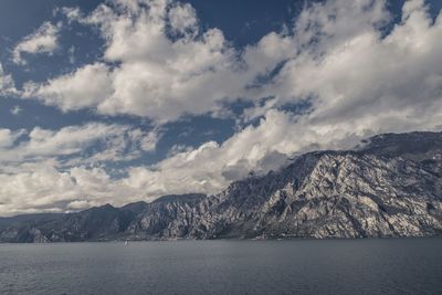 Scenic view of mountains against cloudy sky