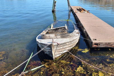 High angle view of old boat moored at pier