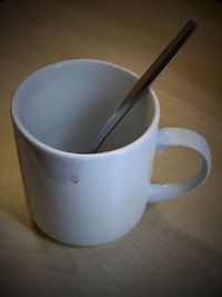 High angle view of coffee cup on table