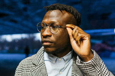 Portrait of young man looking away